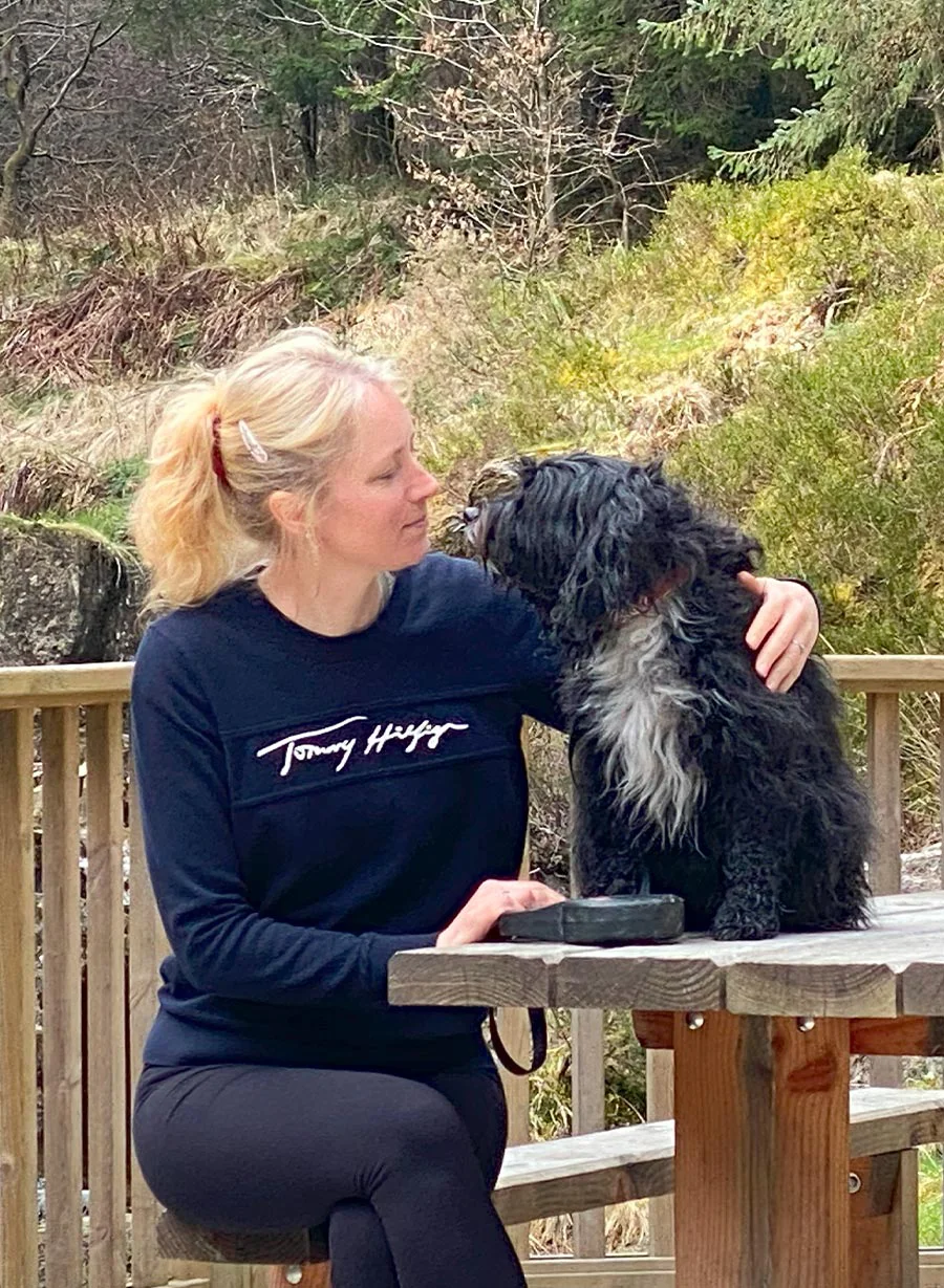 Melanie and her dog Lily enjoying a walk in the scenic Welsh countryside.