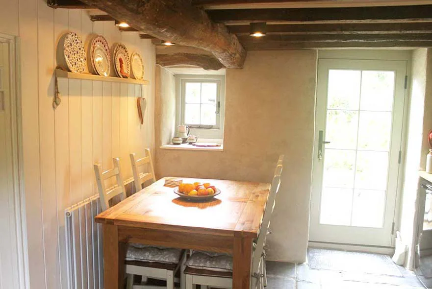 Cottage Kitchen: New Doors The newly installed solid wood back door in the cottage kitchen, painted French Grey.